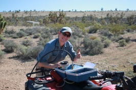 Graduate student Rory O'Connor measuring the water potential of creosote bush in the Mojave Desert.